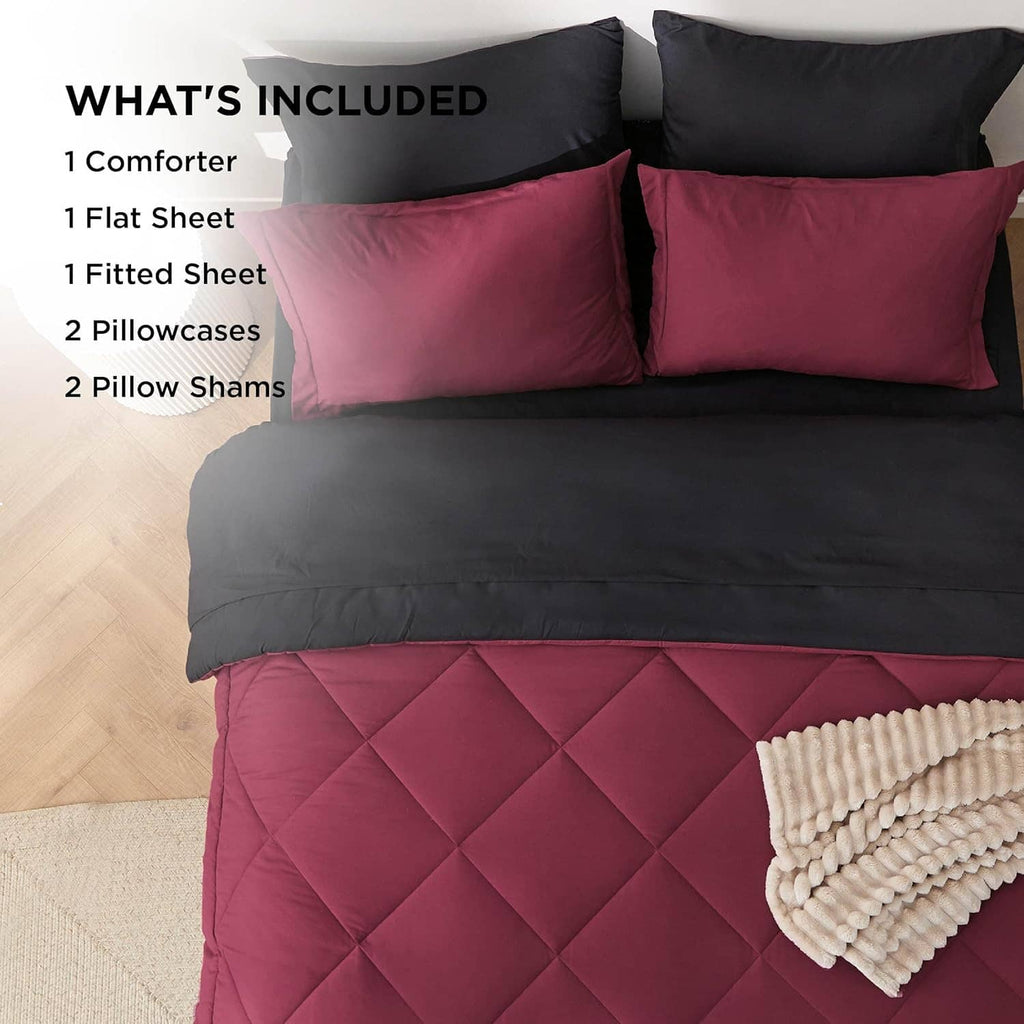 Bedsure queen comforter set laid out with burgundy quilted comforter, black bedding pieces, and pillow