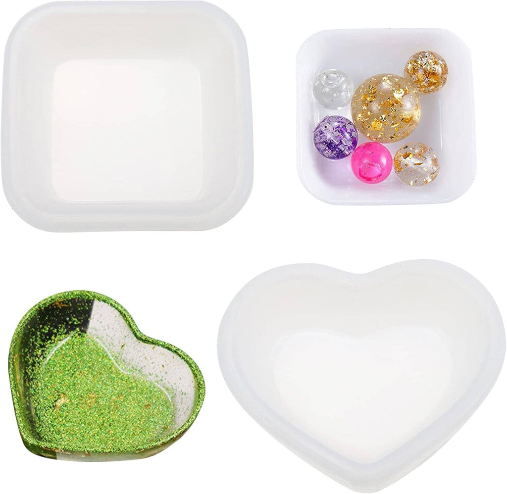 Heart-shaped resin mold set with square cavities; empty tray and heart-shaped silicone piece
