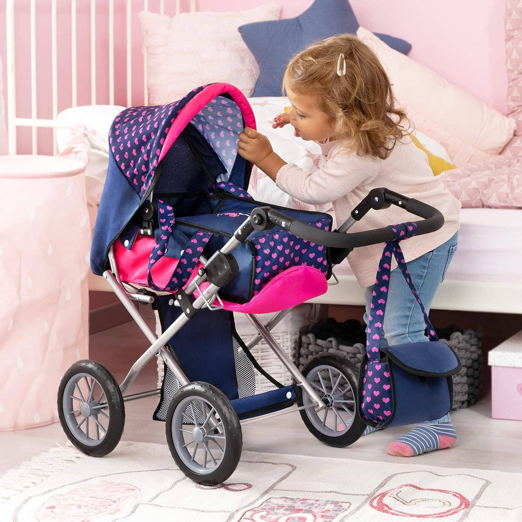 Doll stroller with navy body, pink accents, heart pattern canopy, and accessory bag