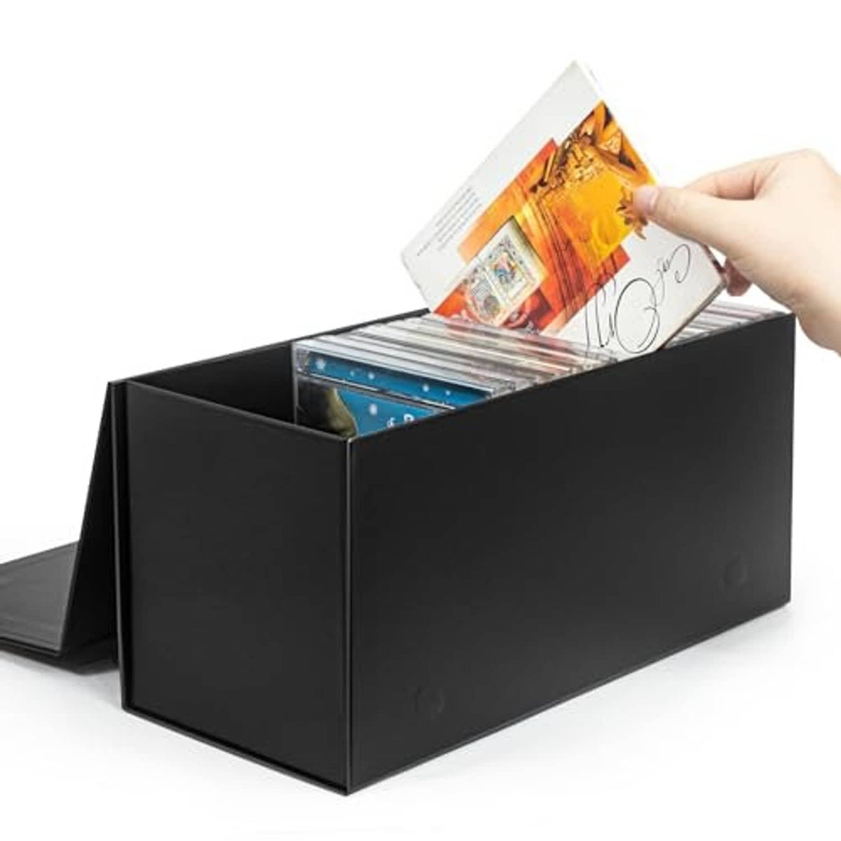 Black CD/DVD storage box with open top, holding slim cases and a jewel case