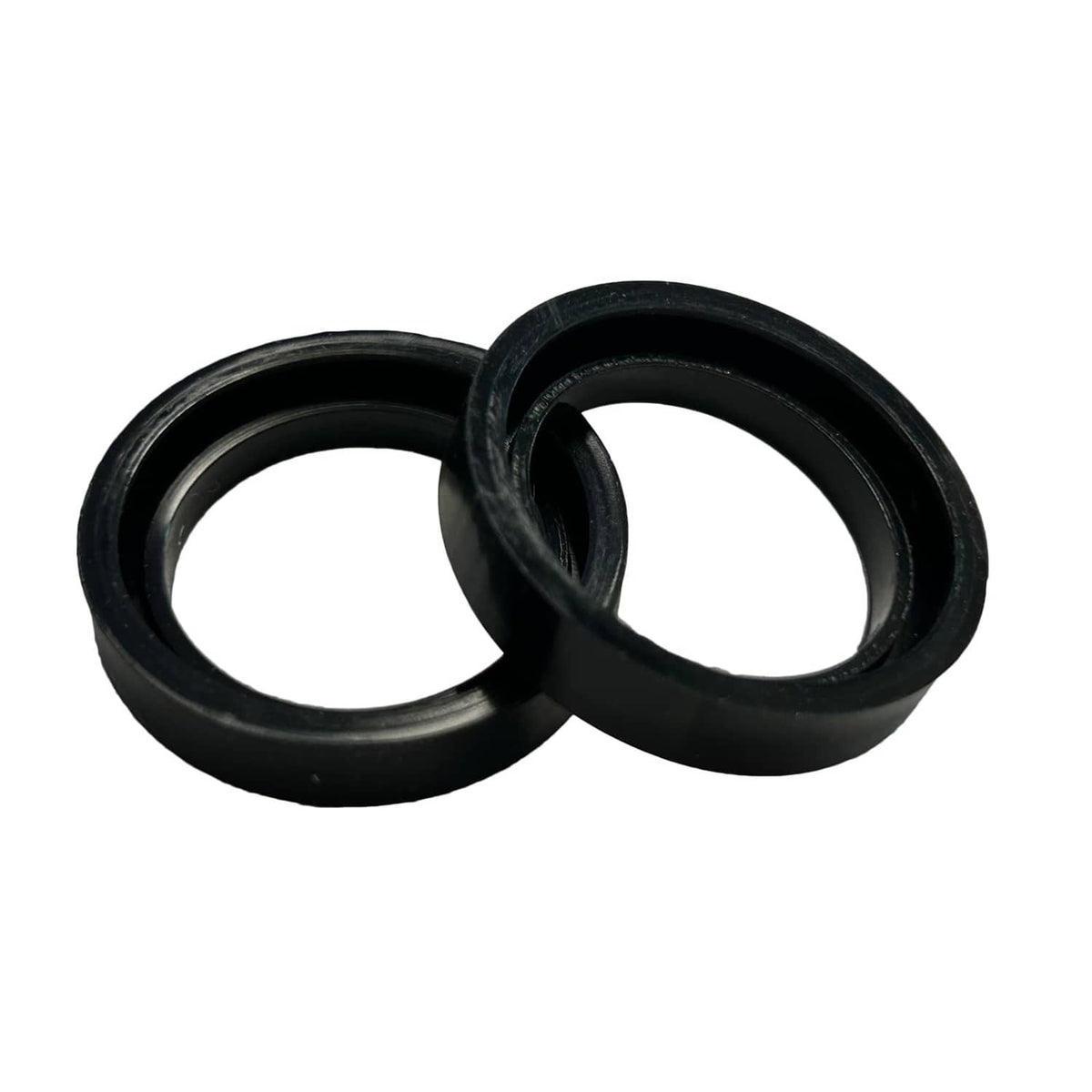 Pair of black round gasket seals, stacked and overlapping