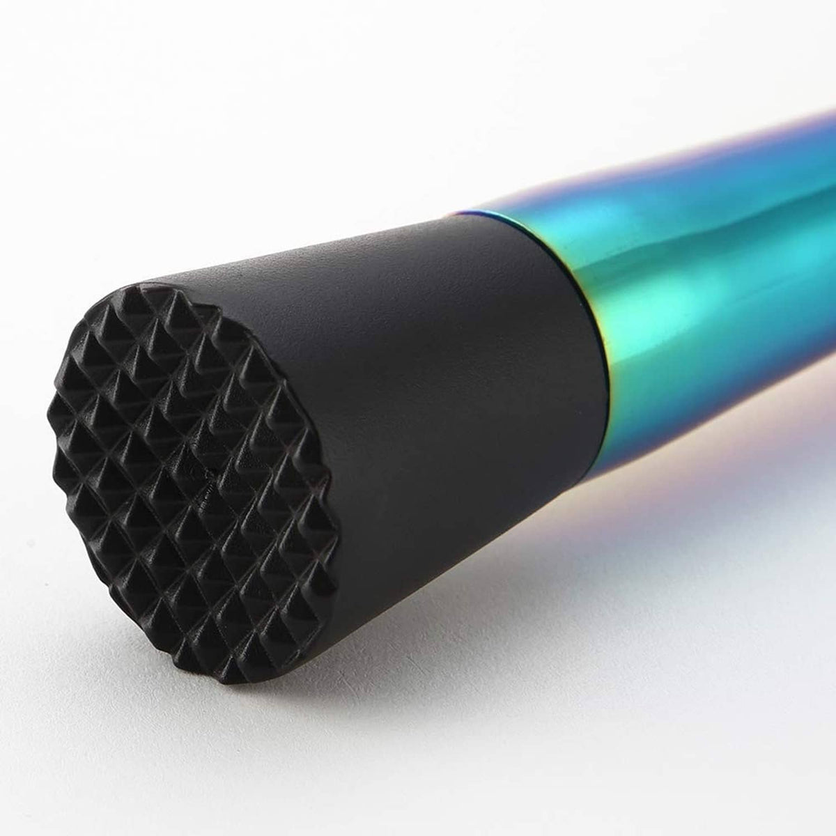 Textured black rubber end on an iridescent stainless steel cocktail muddler