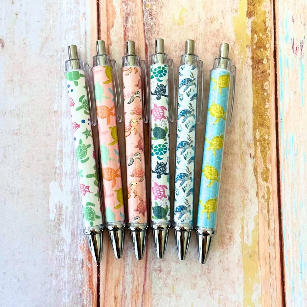 Set of 6 clear-barrel turtle-print pens with silver tips