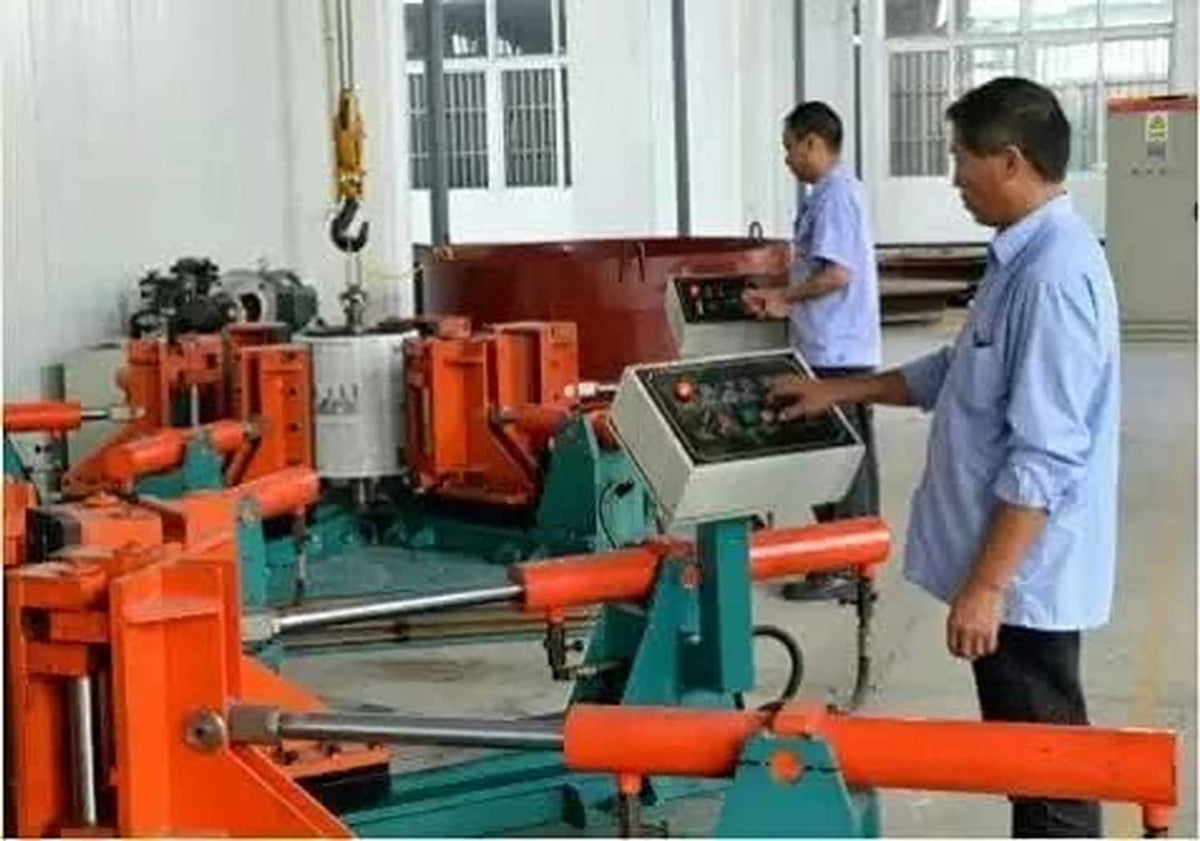 Industrial band saw machine in a workshop with people working