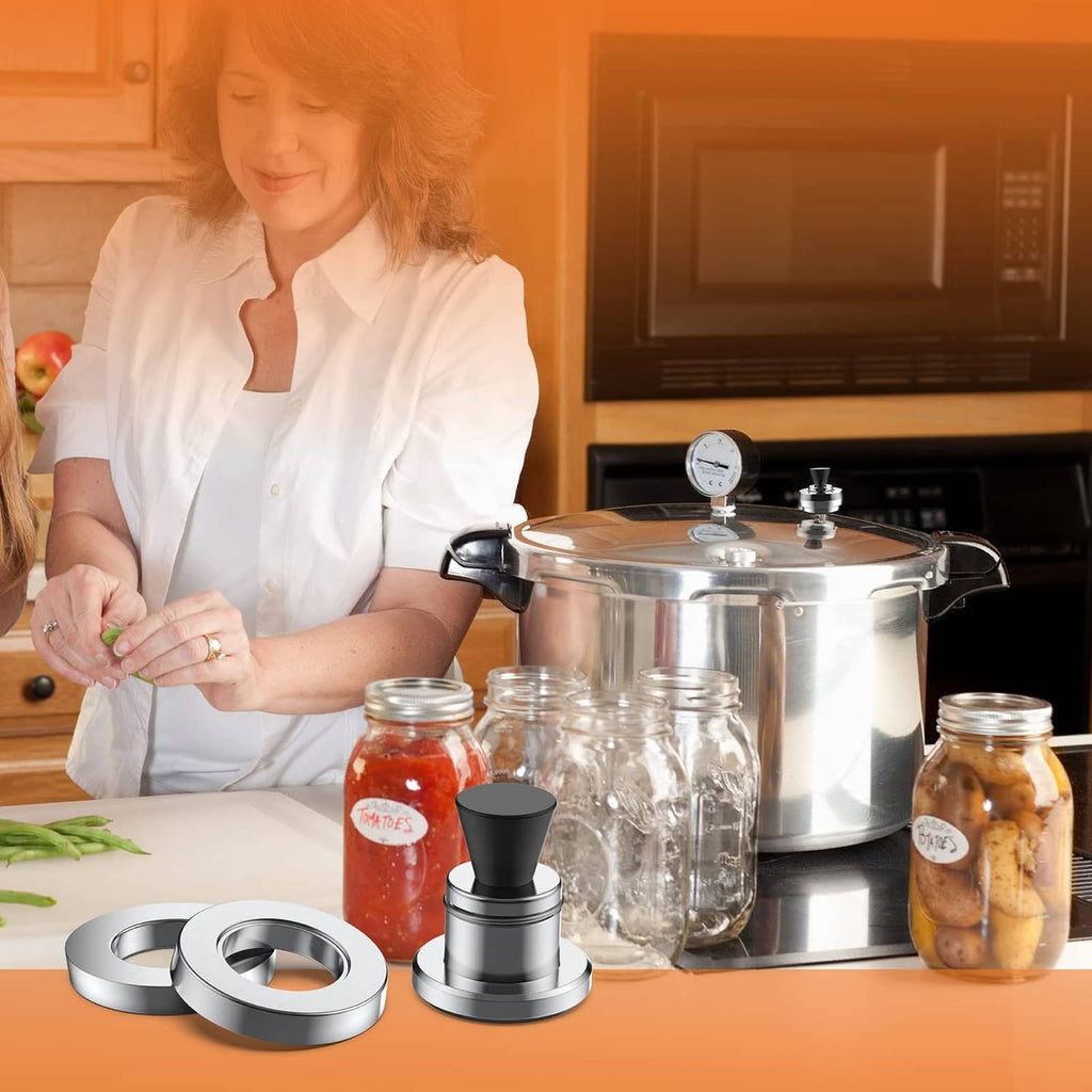 Pressure canner regulator weight with black knob and silver base on countertop.
