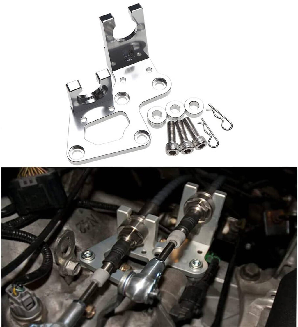 Installed metal transmission shifter cable bracket with hardware on engine bay