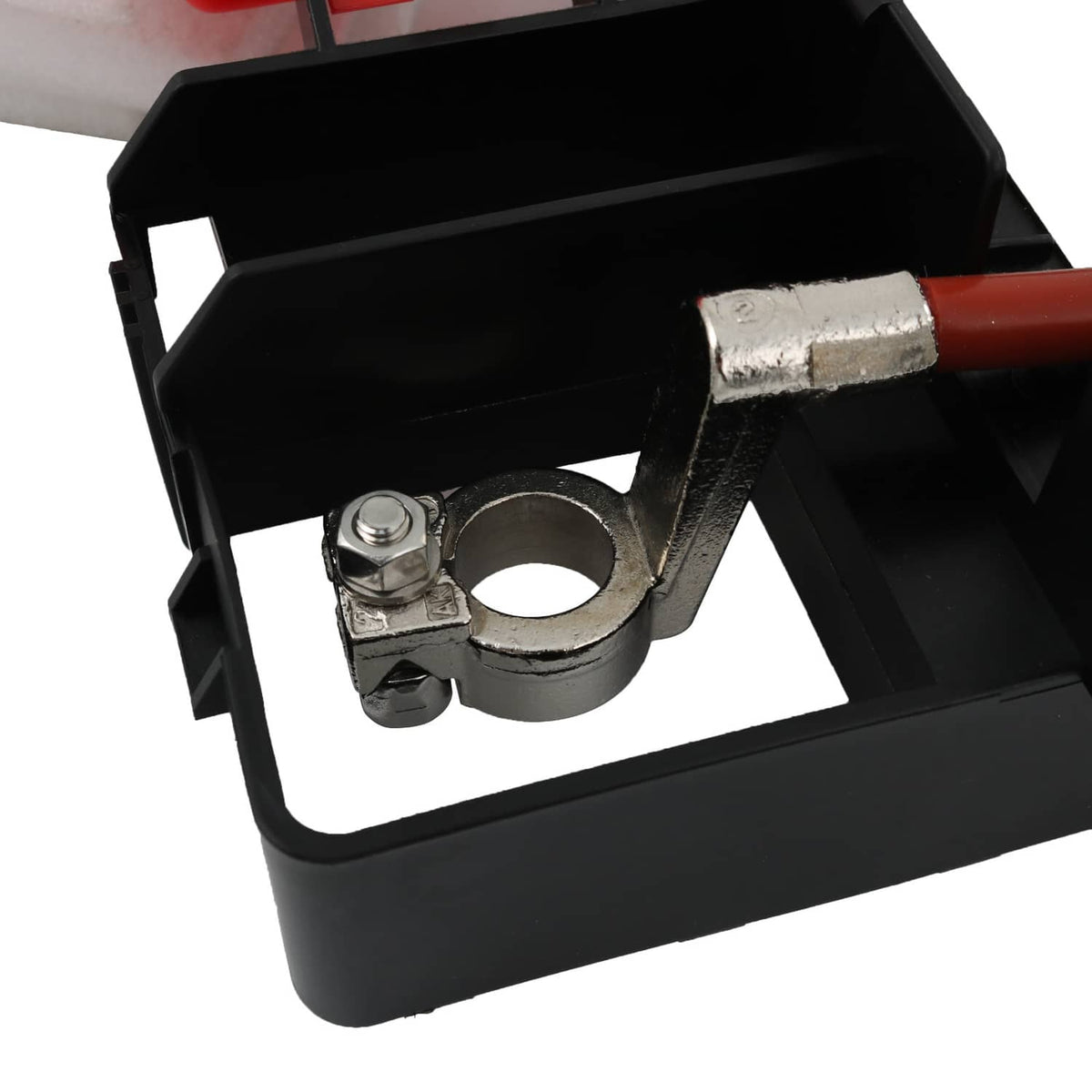 Battery fuse block corner detail with mounting bolt and ring terminal inside black housing