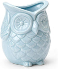 Glazed ceramic owl pen holder in light blue, embossed eyes and feather pattern