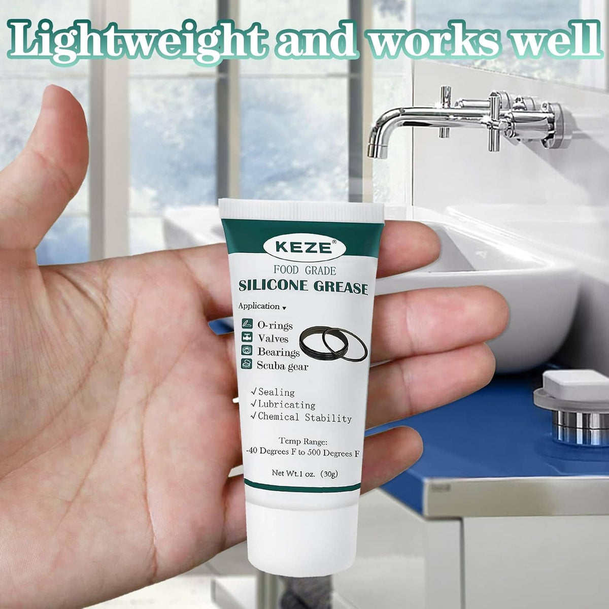 KEZE food grade silicone grease tube held in hand, white tube with green label band