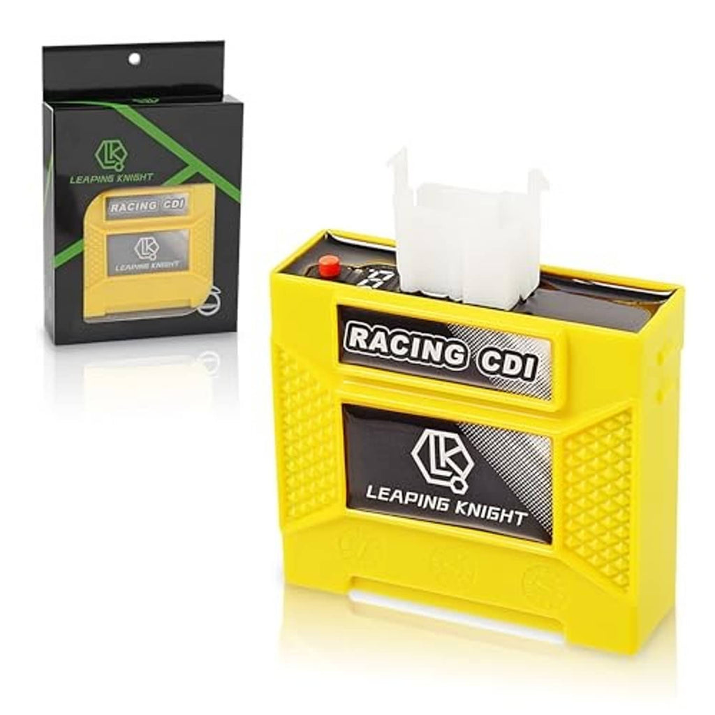 Yellow Racing CDI digital box with open top, white connector plugs, and red button