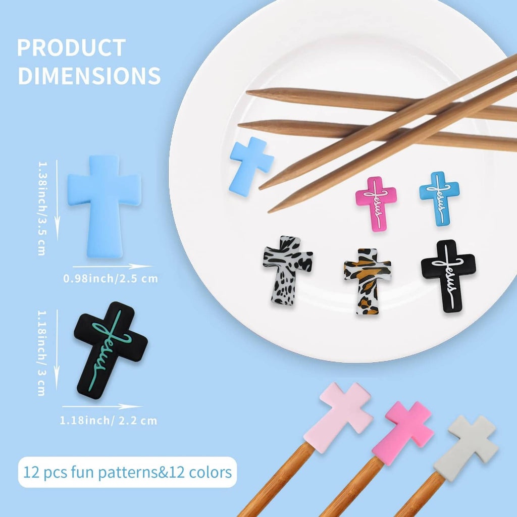 Cross-shaped silicone needle point stoppers in multiple colors on a white plate