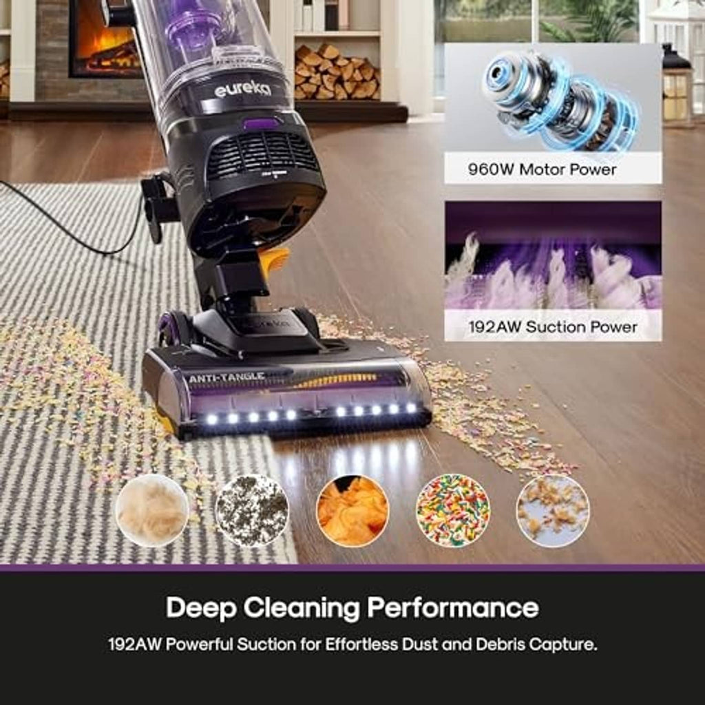 Upright vacuum cleaner with purple cyclone and lit brush bar on carpet