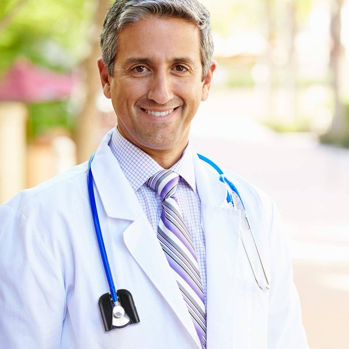 Black plastic stethoscope holder clip attached to doctor’s stethoscope