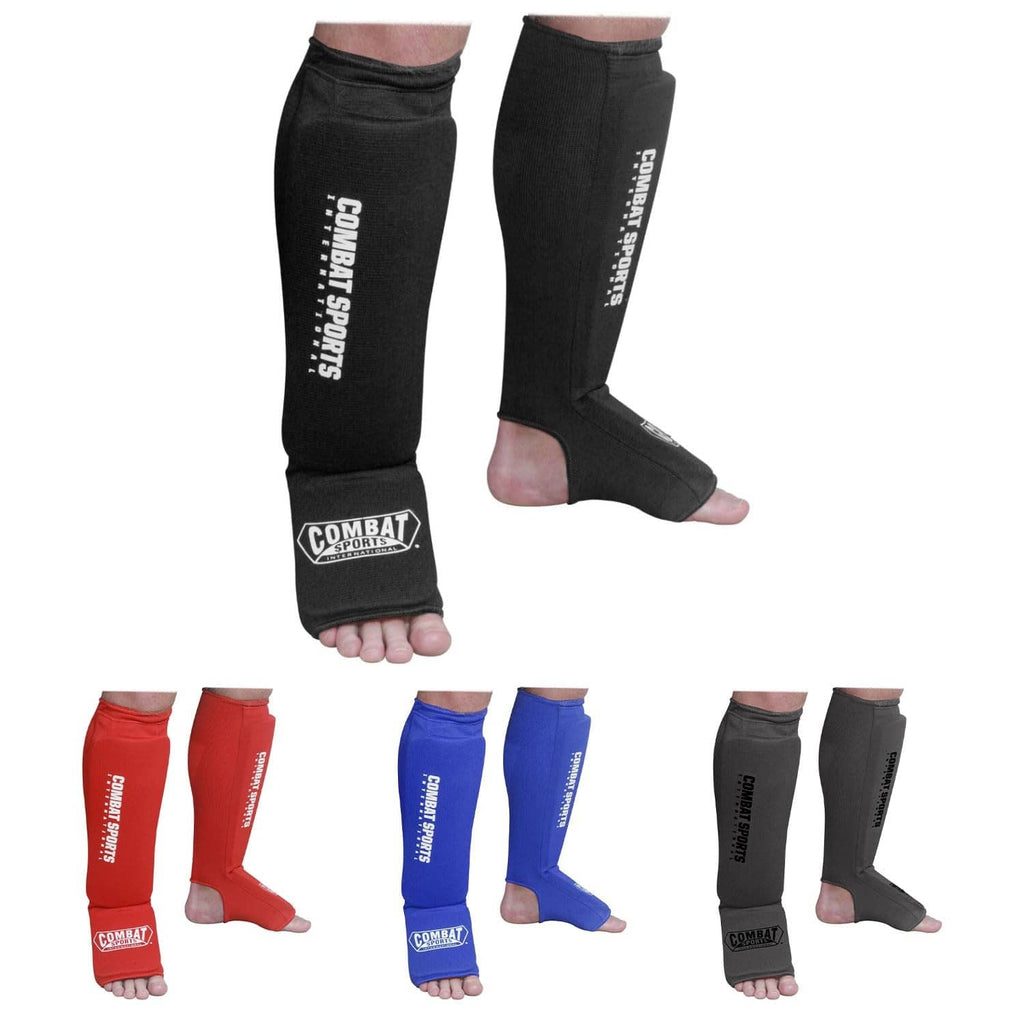 Black full-length padded shin and instep guards with logo patch
