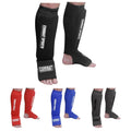 Black full-length padded shin and instep guards with logo patch