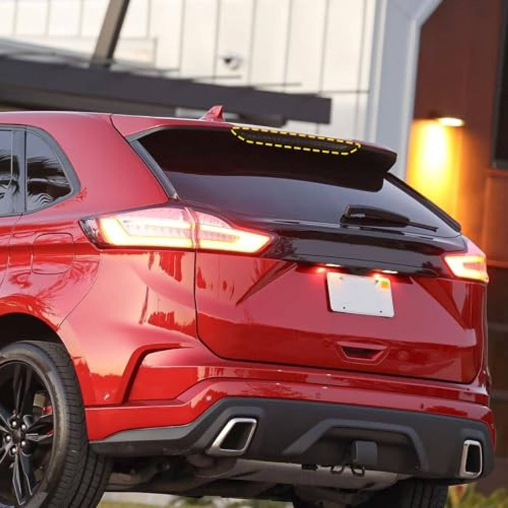 Rear high-mount LED brake light on vehicle, red LED strip glowing