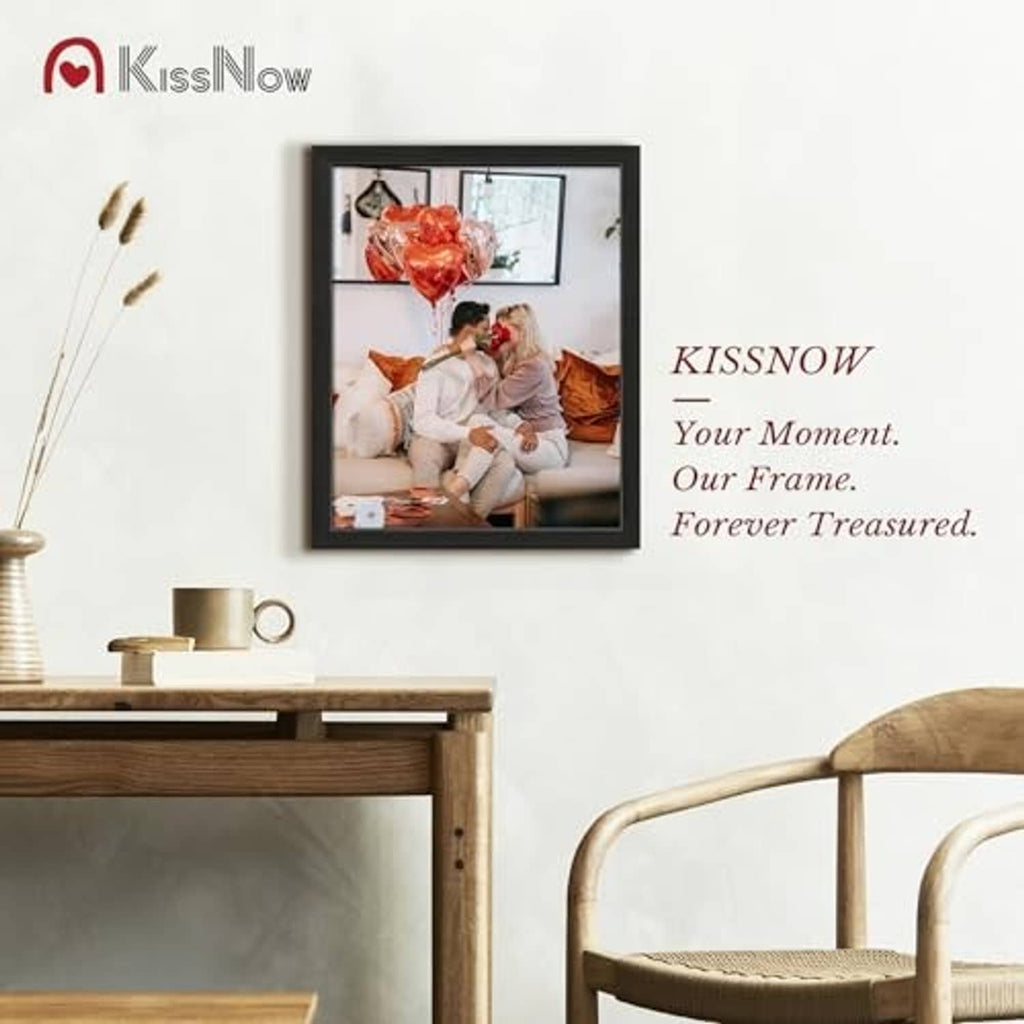 Black 16x20 picture frame mounted on wall with family portrait