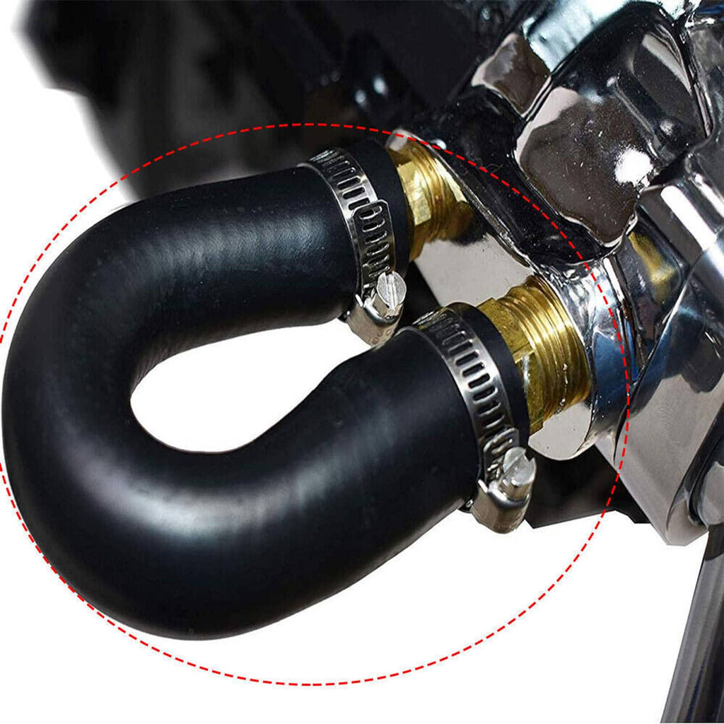 Close-up of black coolant hose connected to brass fitting with metal clamps