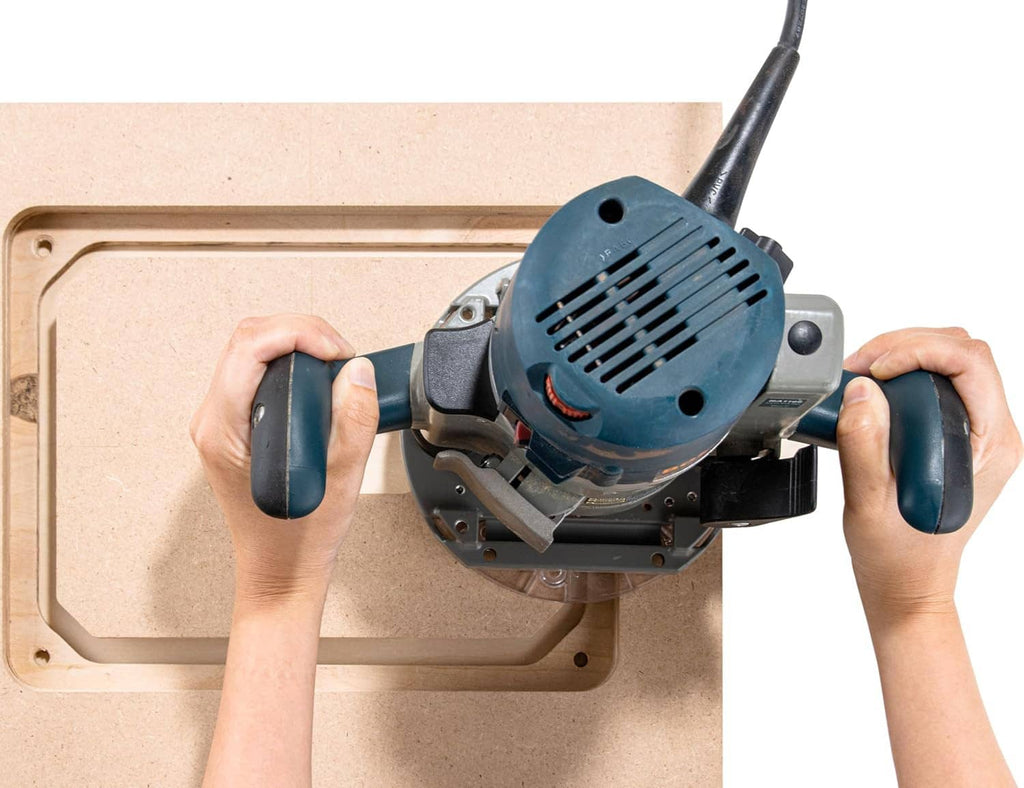 Router tool mounted on MDF router table insert plate with rectangular opening