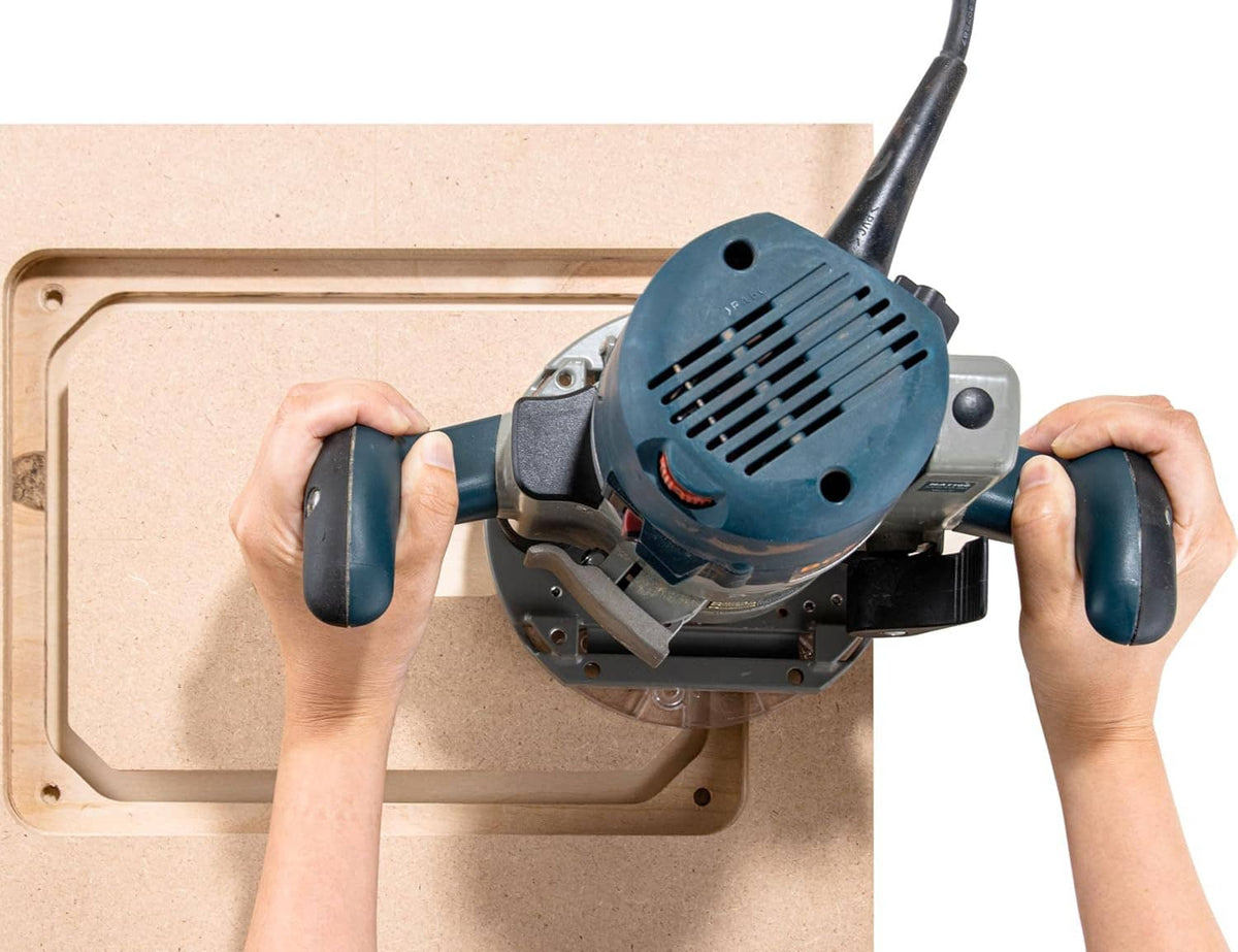 Router tool mounted on MDF router table insert plate with rectangular opening