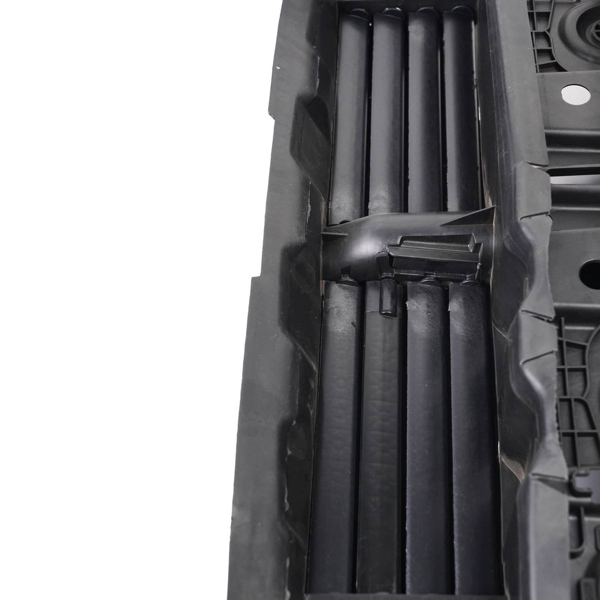 Close-up of black grille shutter slats inside the motor housing