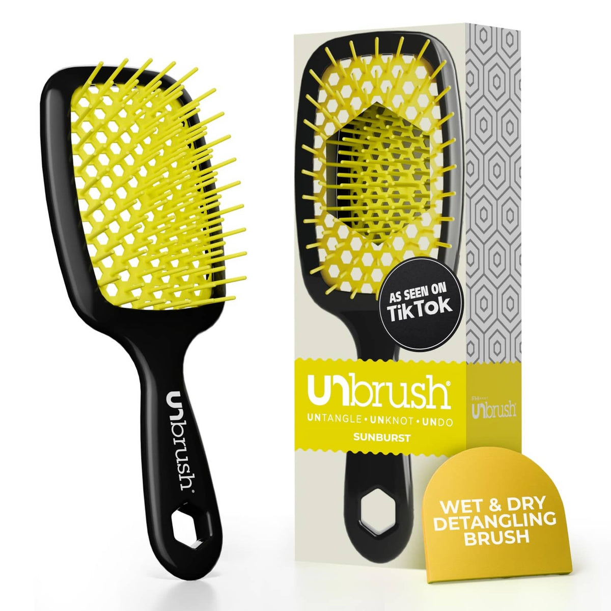 Yellow bristle detangling hair brush with black handle and vented cushion base