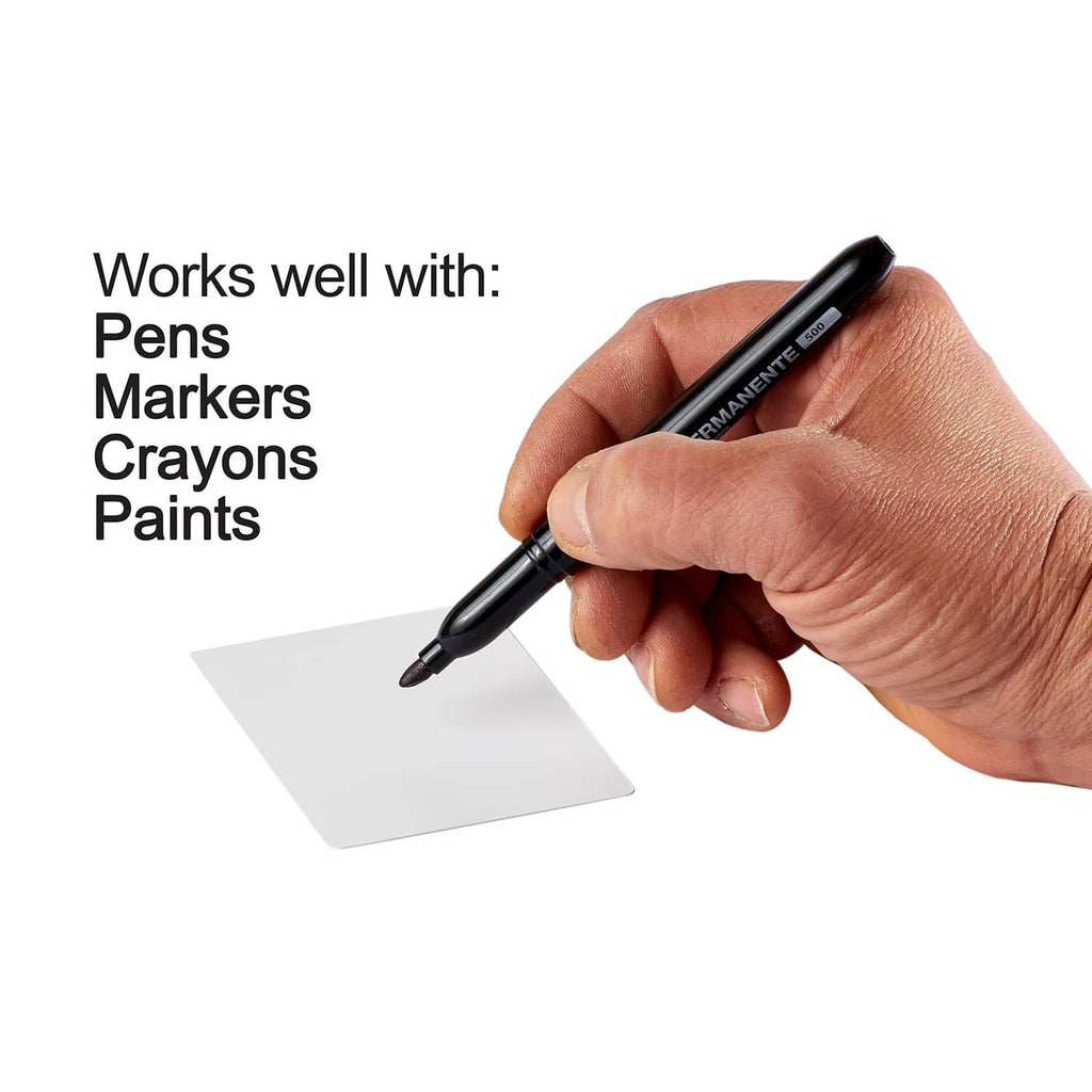 Hand draws on a blank playing card with a black marker pen