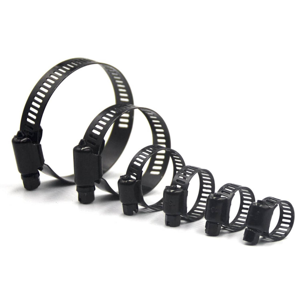 Assorted black worm gear hose clamps laid out, different band diameters