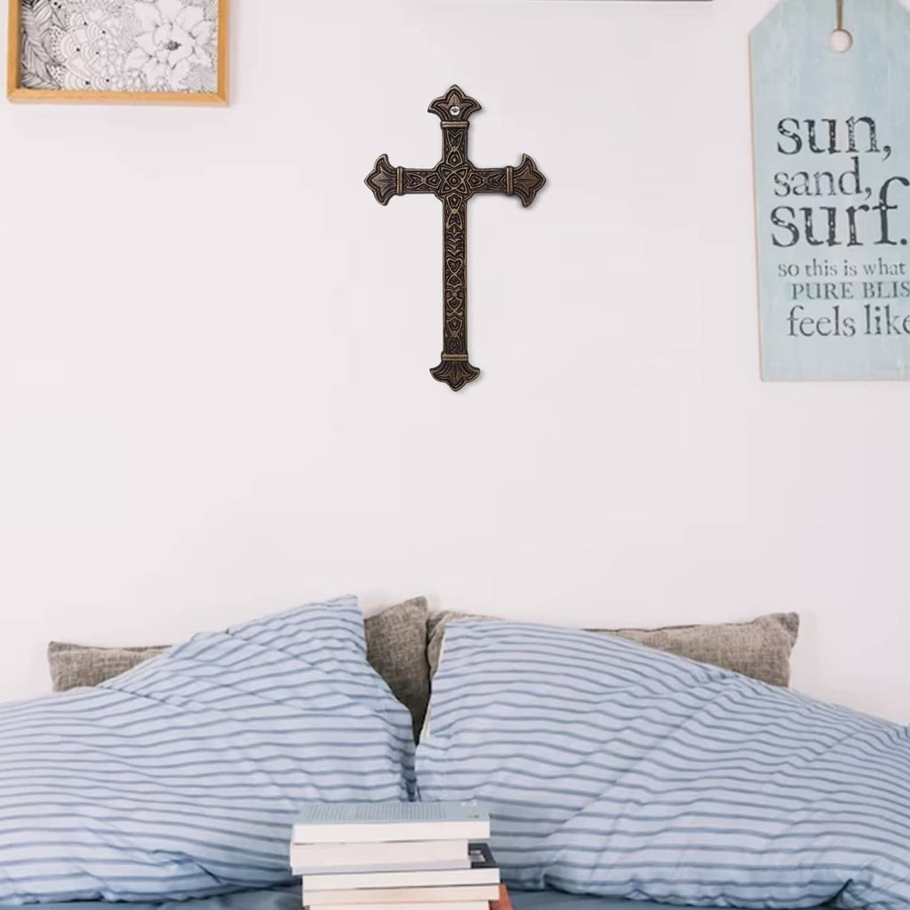 Antique metal Christian wall cross with raised filigree and small heart accents