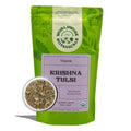 Organic Krishna Tulsi loose leaf tea in a green stand-up pouch, loose leaf cut