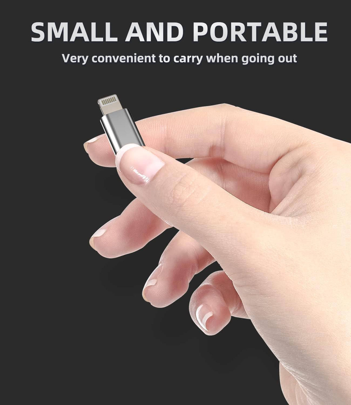 USB-C to Lightning adapter small plug held in hand, silver metal connector