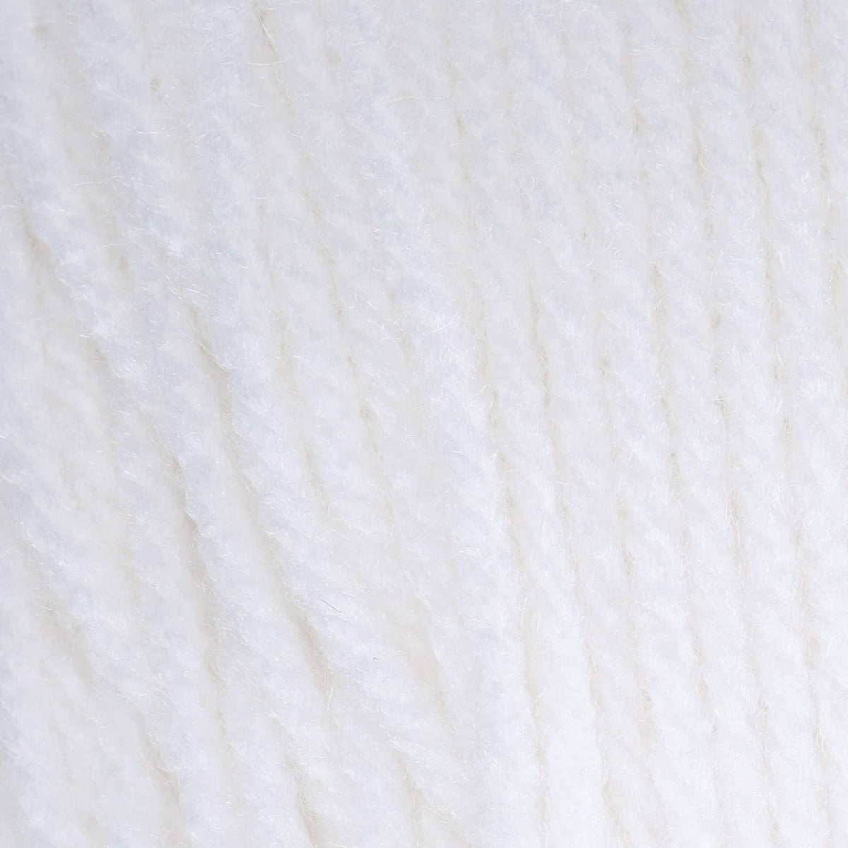 White acrylic yarn texture, tightly spun strands close-up