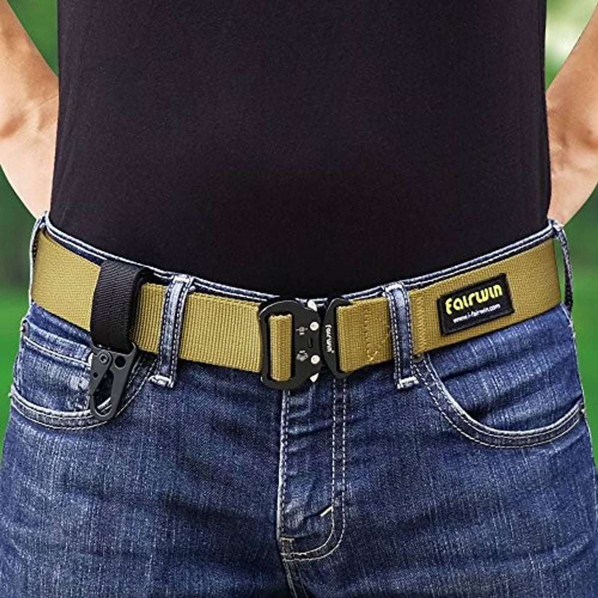 Black and yellow key ring belt holder clipped to denim waistband
