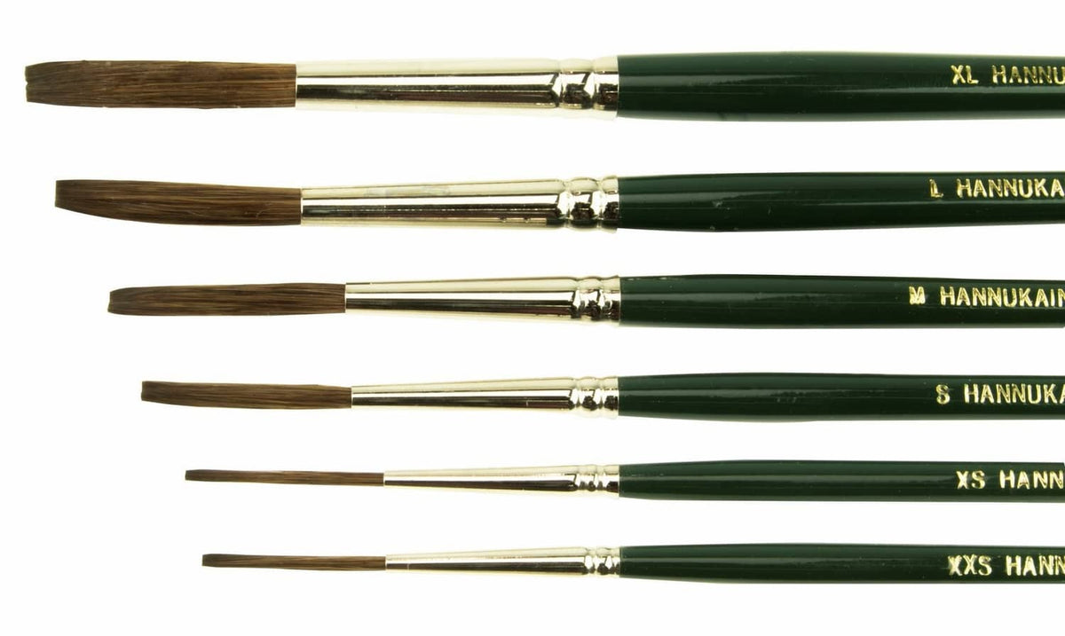 Close-up of quill brushes, HANNUKAINE/black bristles on green handles with yellow tips