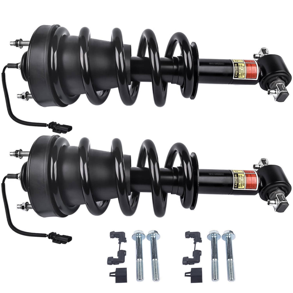 Pair of front shock struts with black coil springs and cylindrical housings