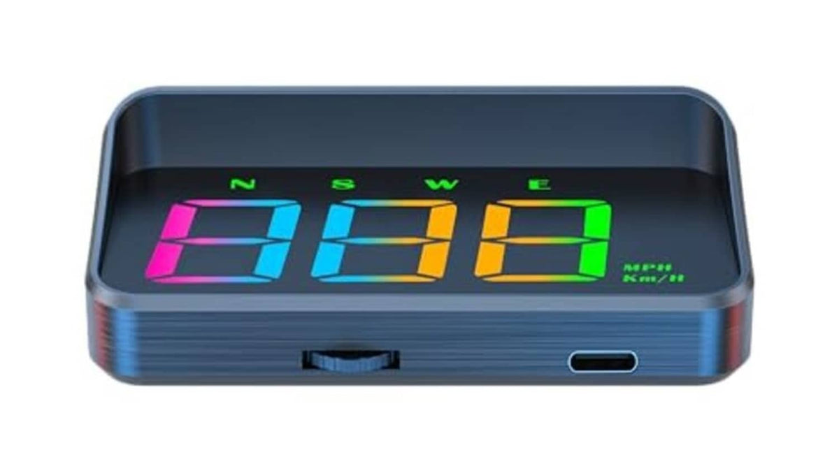 Dark blue HUD projection display showing multicolor speed digits and tiny indicators