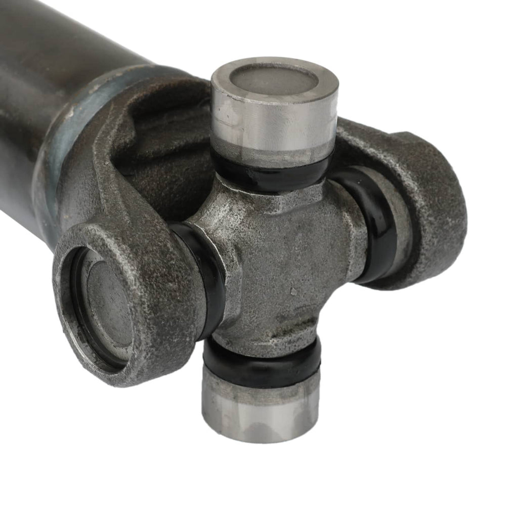 U-joint end with cross bearings and metal cap on front prop drive shaft