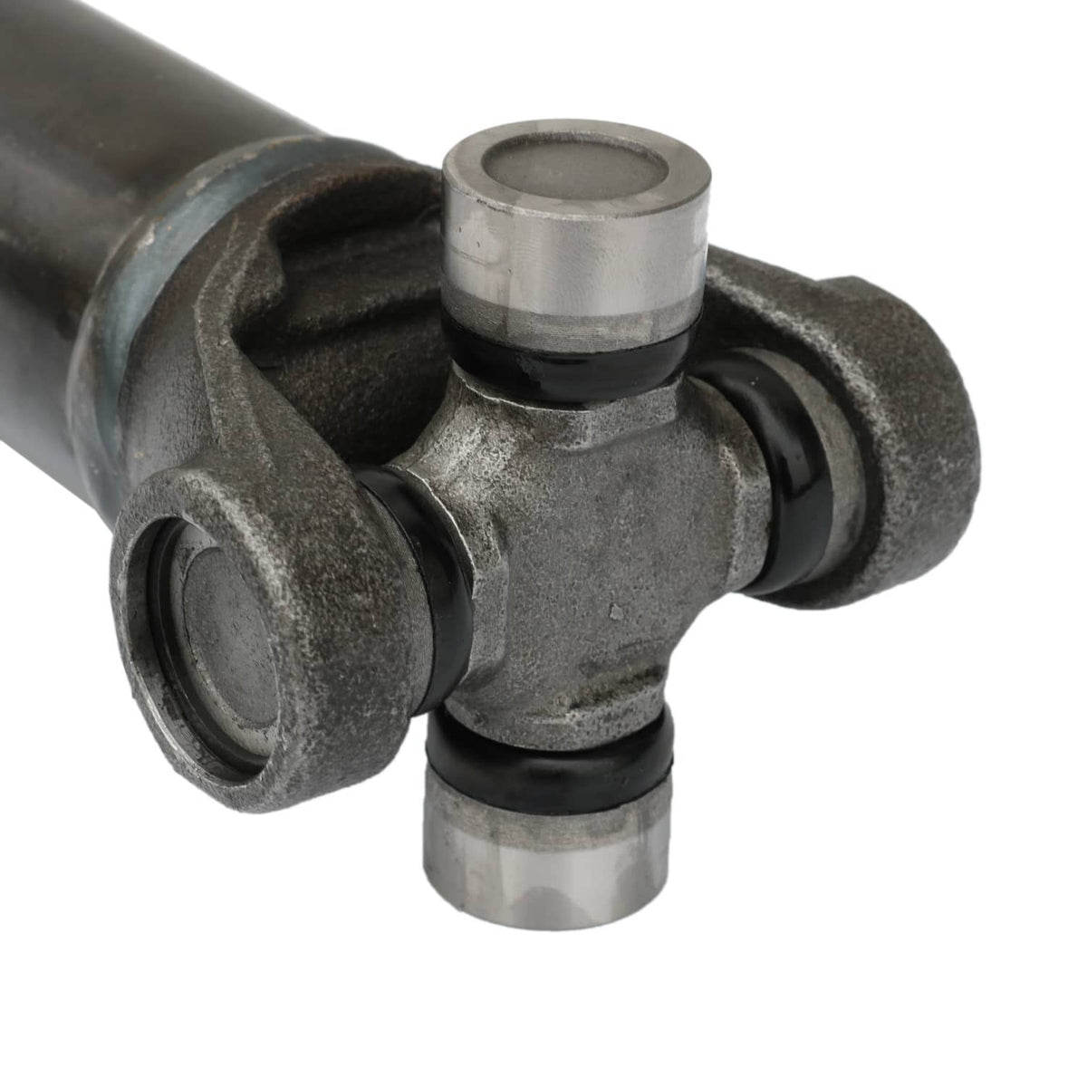 U-joint end with cross bearings and metal cap on front prop drive shaft