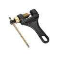 Motorcycle chain breaker tool with black lever handle, brass pin, and threaded screw head