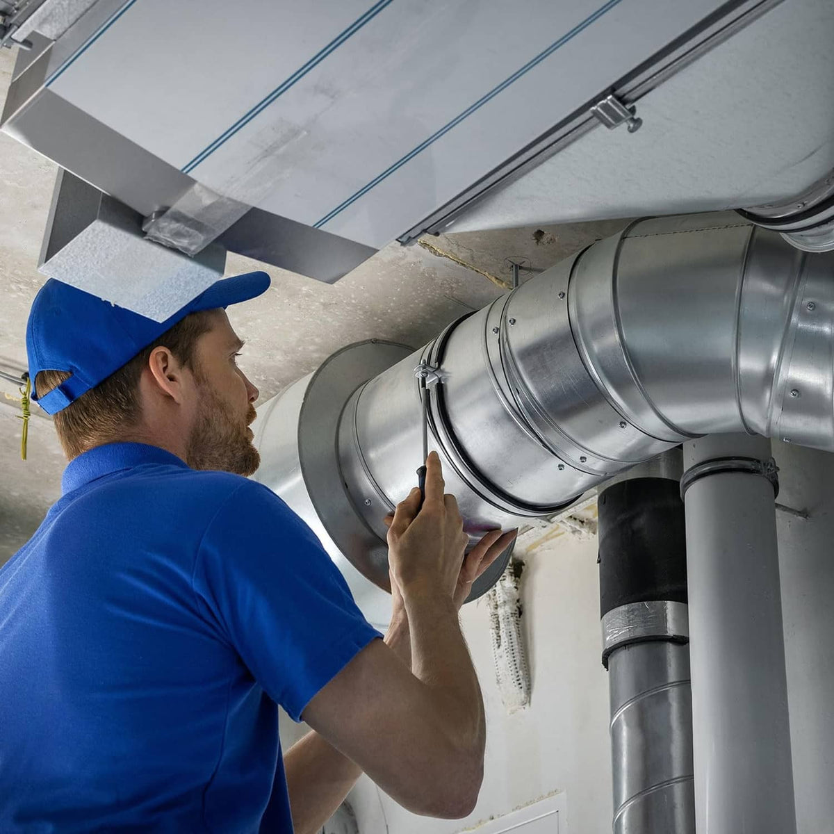 Galvanized duct connector coupling installed on HVAC ductwork, silver metallic finish