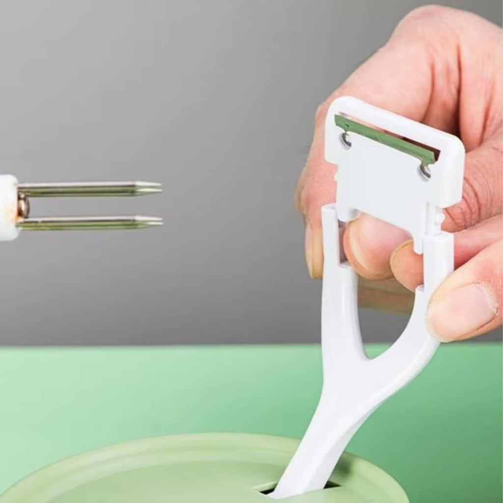 White apple peeler blade holder with metal scraper blade inserted