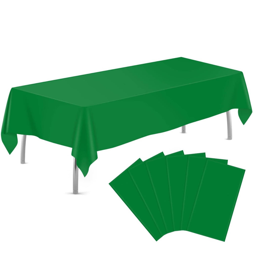 Green rectangular plastic tablecloth draped over a table with corner drop