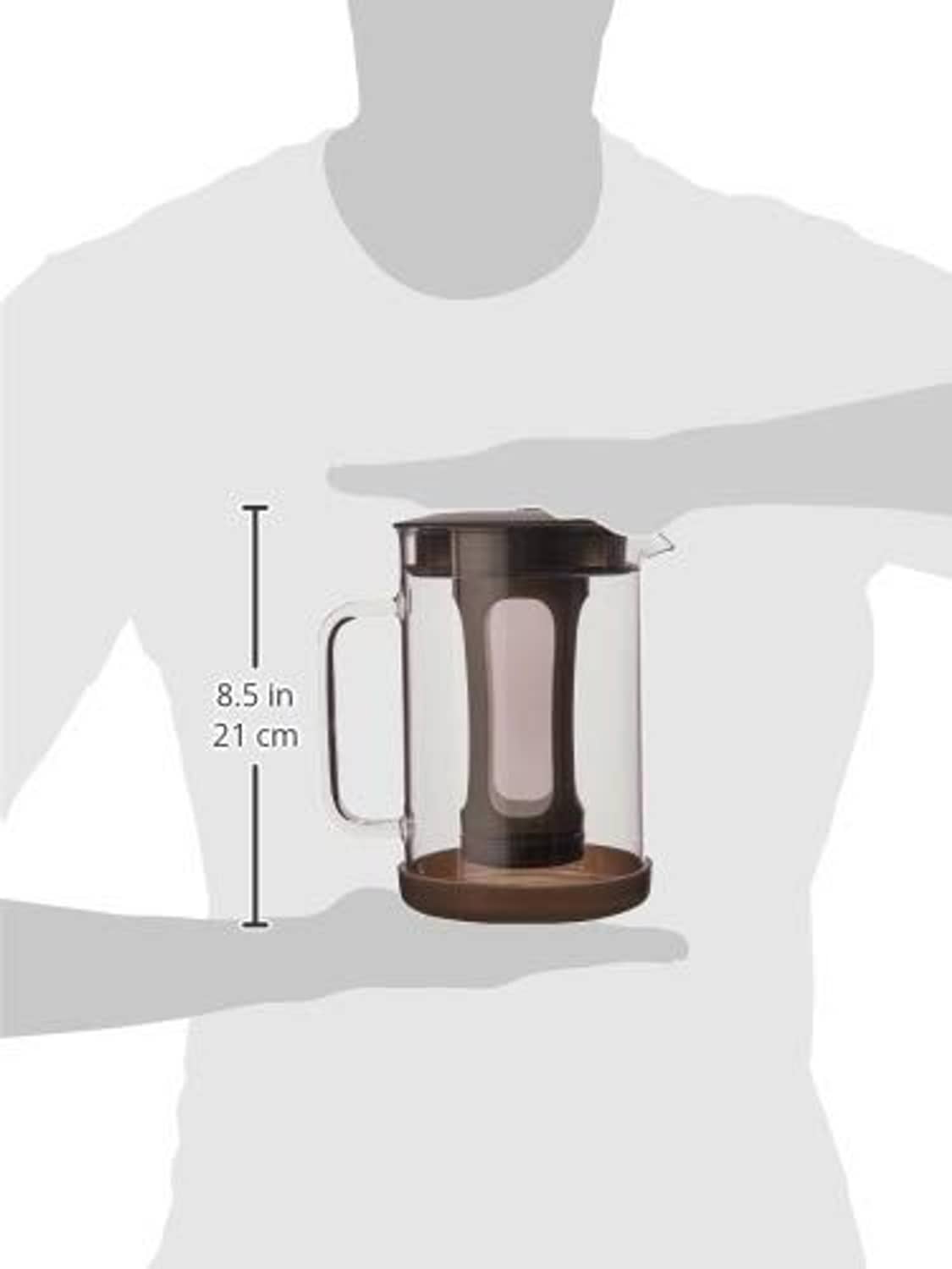 Cold brew coffee maker with clear glass pitcher and black lid, shown for scale
