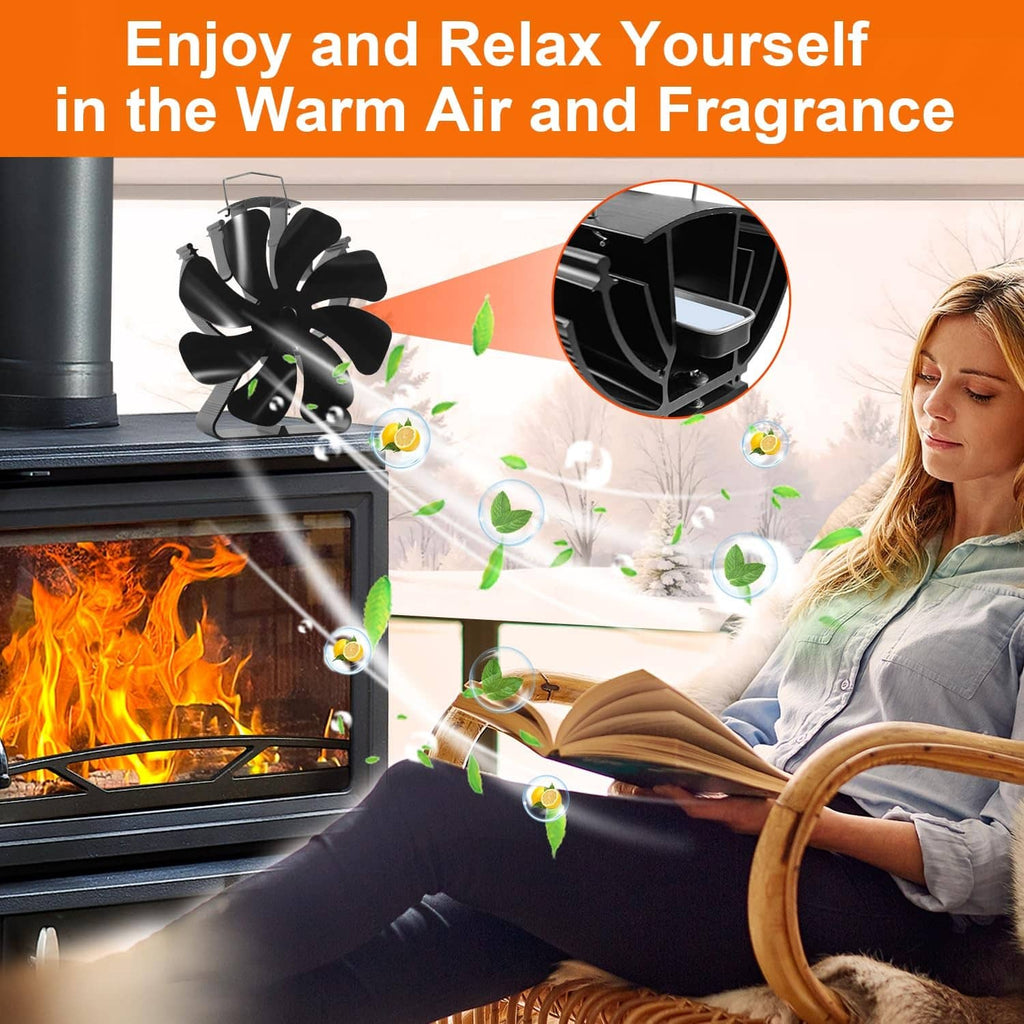 Black heat-powered 8-blade stove fan beside a lit fireplace