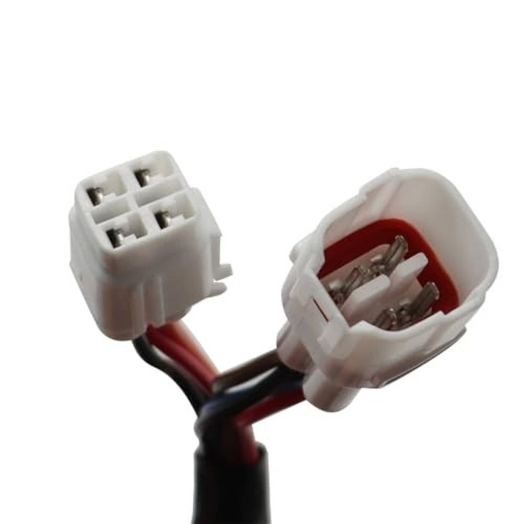 Close-up of black wire harness with white connectors and exposed metal contacts