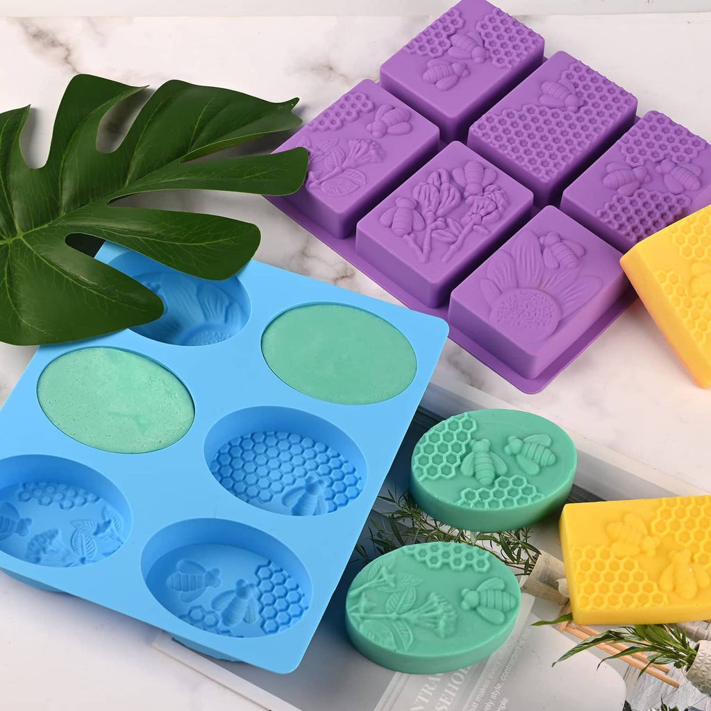 Silicone honeycomb bee soap molds set with oval and rectangular cavities in purple, blue, green