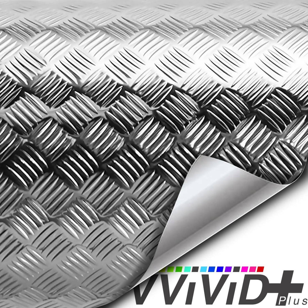 Diamond-plate metallic chrome vinyl wrap close-up, raised diamond texture