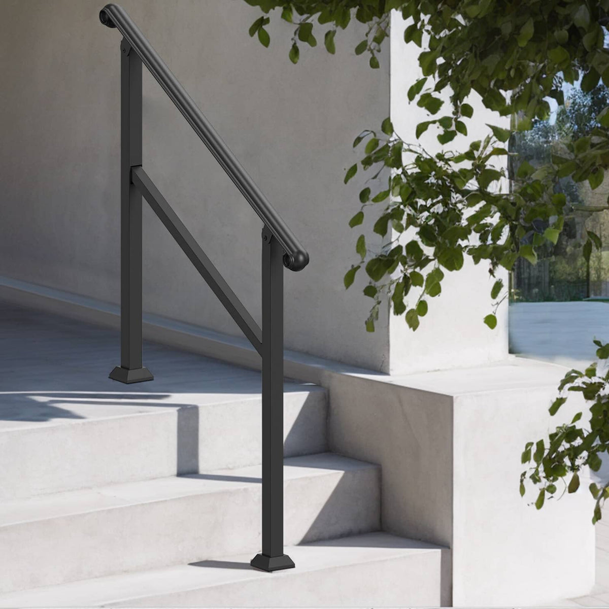 Black outdoor stair handrail with diagonal bar and rounded top grip on steps