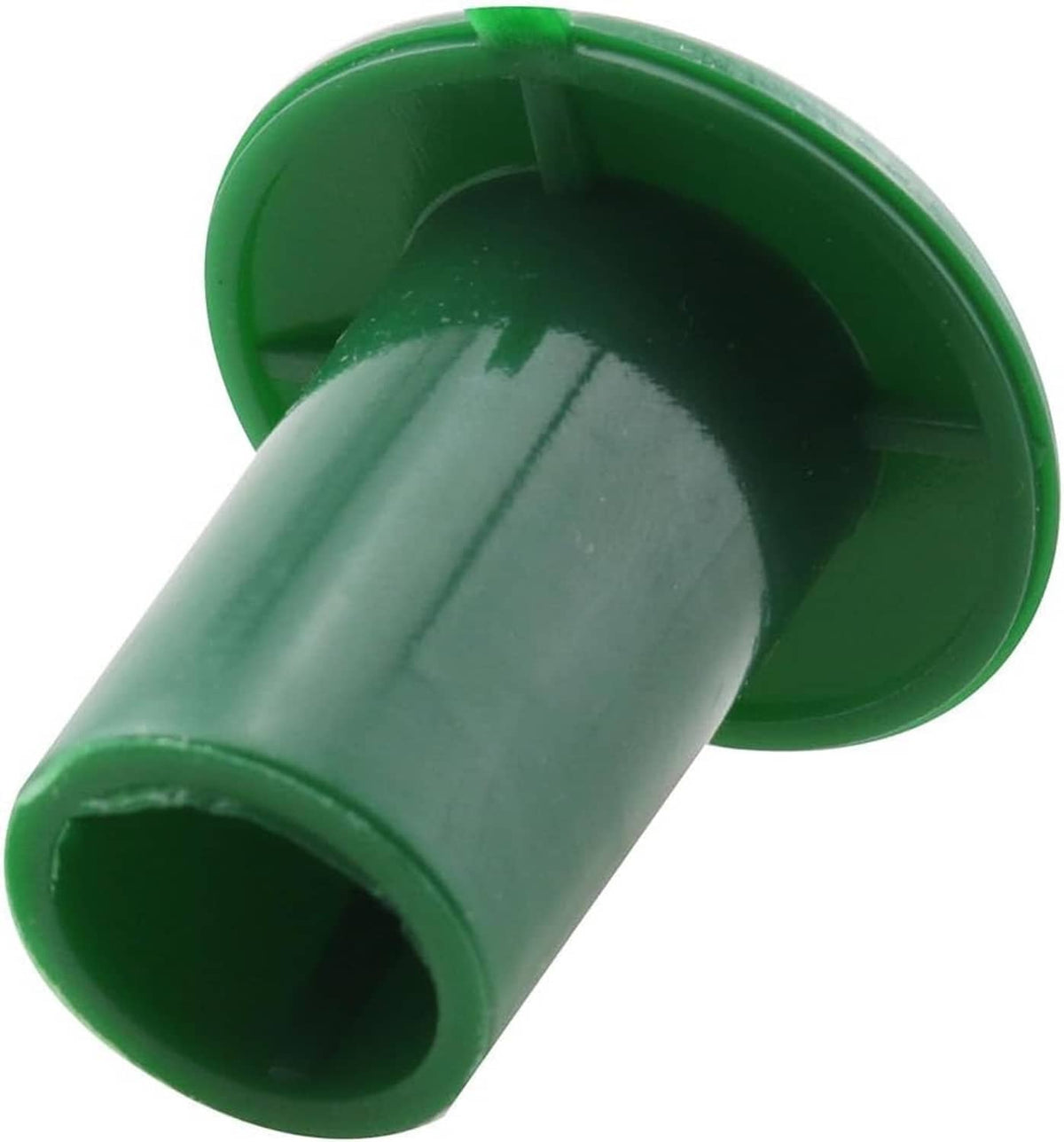 Green plastic mushroom cap with open underside and cylindrical stem end, close-up view