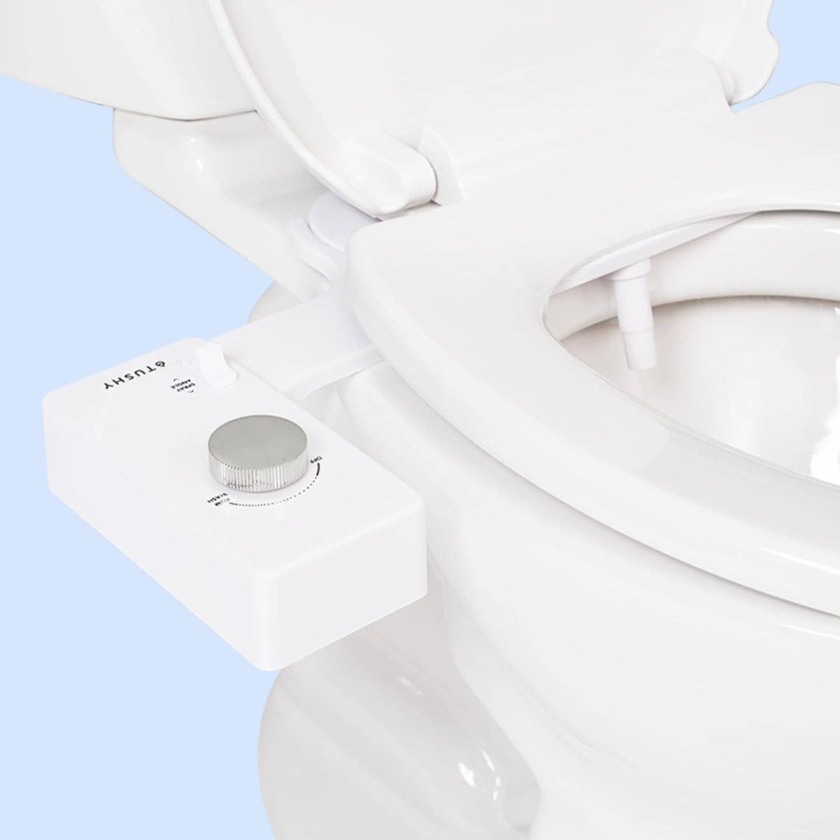 Non-electric white bidet toilet seat attachment with circular control knob and nozzle